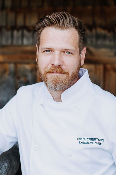 A profile showing the sincere looking Executive Chef, Evan Robertson.