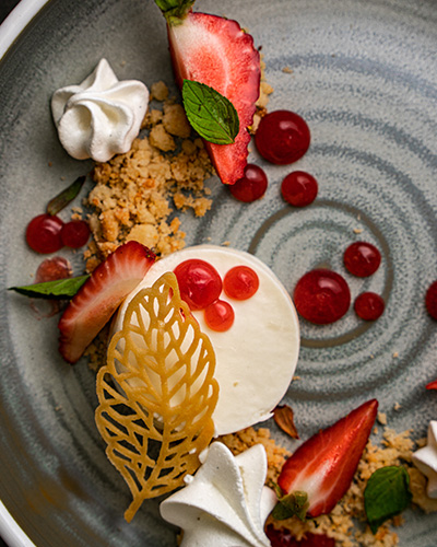 Beautifully plated strawberry and panna cotta dessert